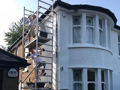 Exterior painting professionals Cardiff detached house after renovation front and side