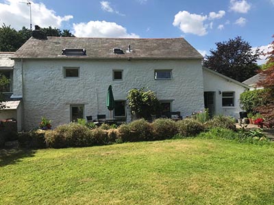 Exterior painting professionals Cardiff coutry house after renovation with mature large garden