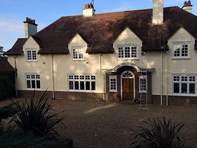 Exterior painting professionals Cardiff large country house front view with door